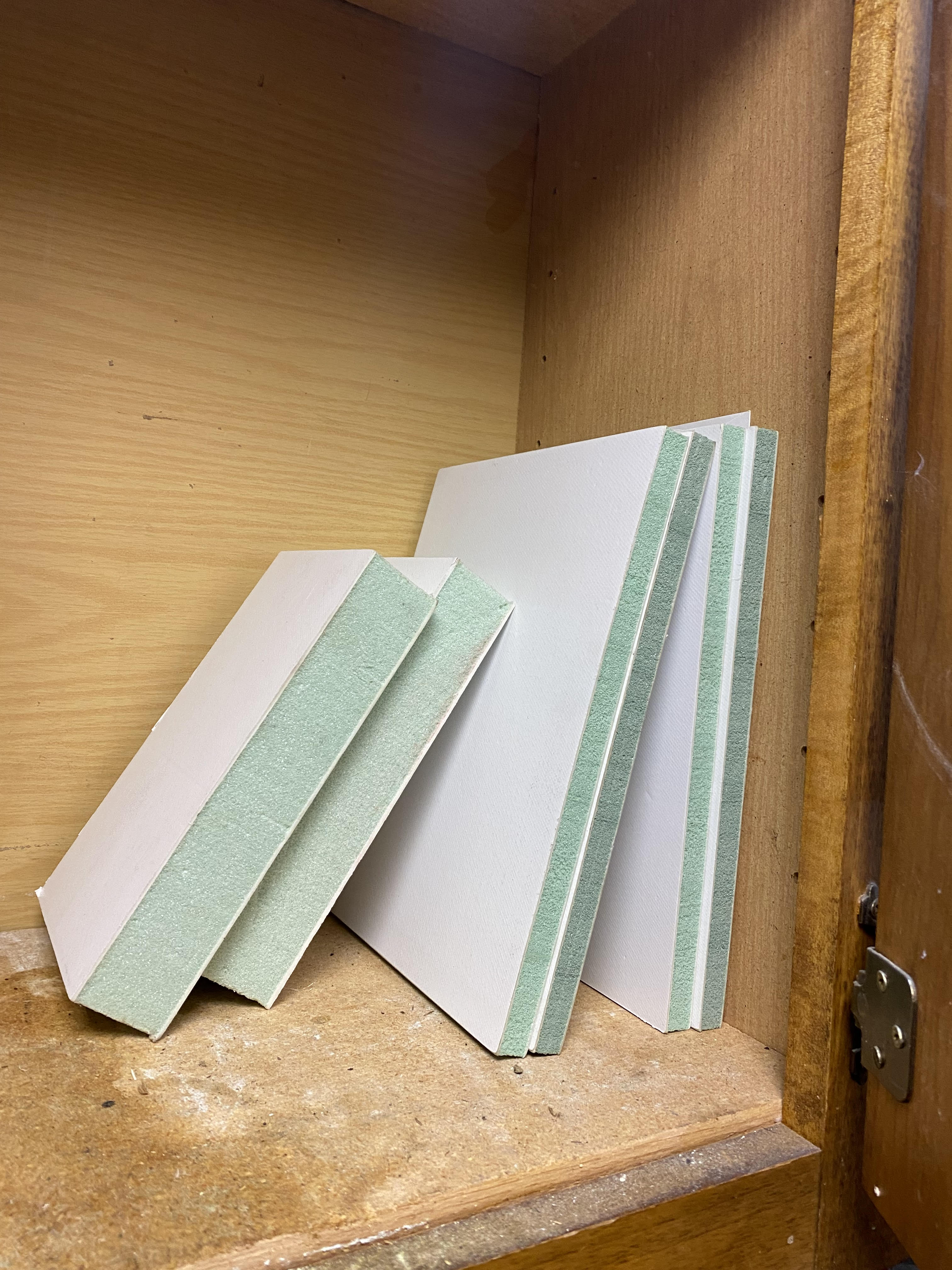 OmneBoard panel samples showing white face and engineered foam core edge