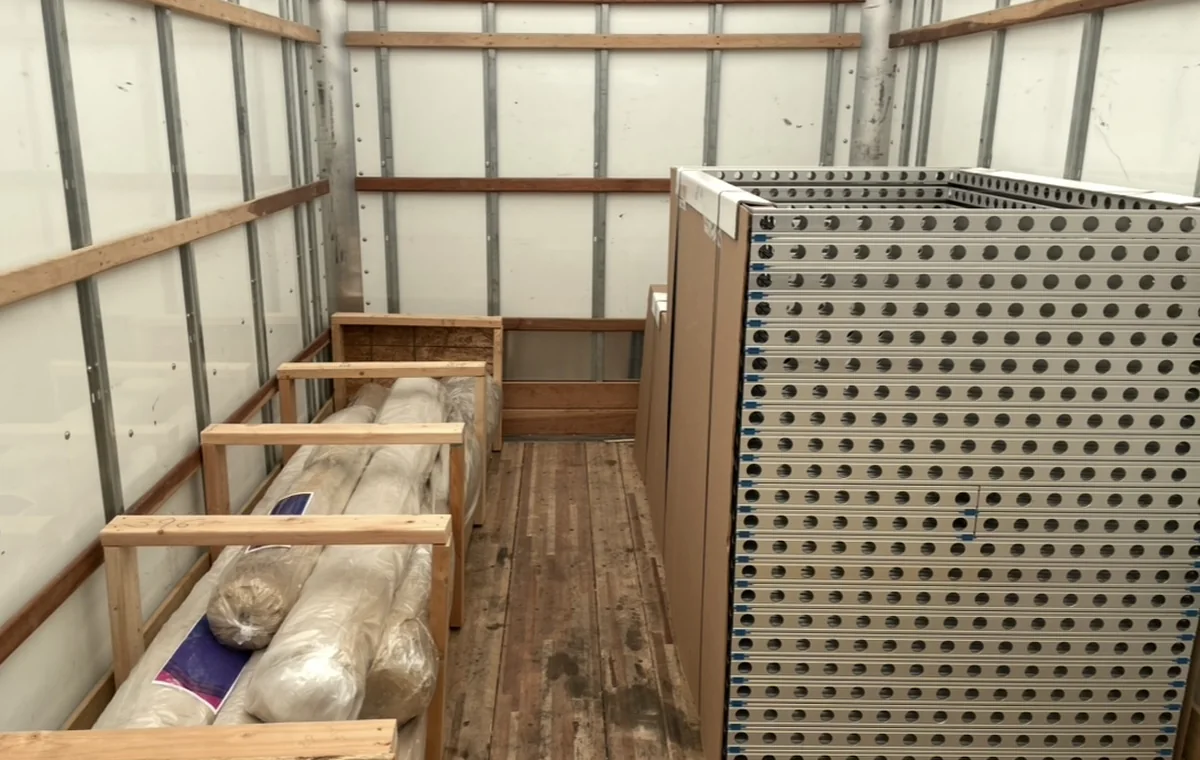 Freight-ready OmneBoard panels staged in a cargo trailer
