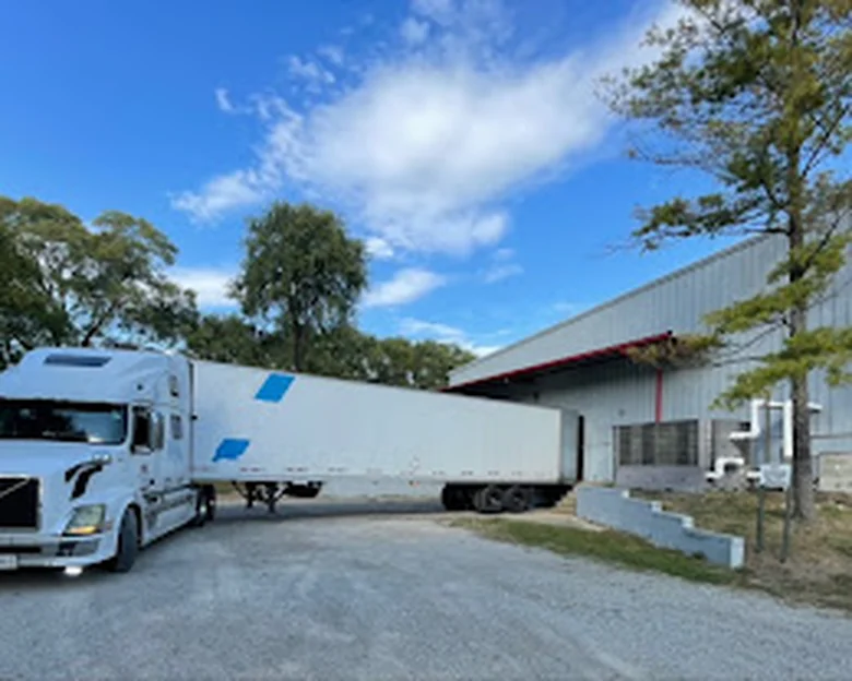 Truck positioned at a loading dock for freight operations